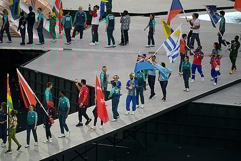 Flag bearers march during the 2024 Summer Olympics closing ceremony